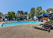 Thumbnail 19 of 57 - Outdoor pool area with lounge chairs at Pointe Niguel, Laguna Niguel, California
