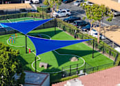 Thumbnail 50 of 57 - A blue shaded area is in the middle of a green field.