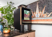 Thumbnail 40 of 59 - Coffee machine with clubhouse at The Preston Miracle Mile Apartments, Los Angeles, California