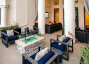 Thumbnail 57 of 59 - Dog-Friendly Apartments in Los Angeles, CA - The Preston - Outdoor Lounge with Patio Furniture, Firepit, and Tall Pillars.