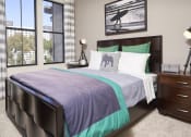Thumbnail 14 of 84 - Pet Friendly Apartments in Mission Valley CA - The Promenade Rio Vista - Bedroom Carpeted Floor, Bed, Nightstands with Lamps, Framed Wall Art, and Windows with Curtains at The Promenade Rio Vista, San
