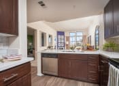 Thumbnail 12 of 84 - Kitchen With Stainless Steel Appliances, and Modern Wood Cabinets at The Promenade Rio Vista, California, 92108