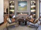 Thumbnail 22 of 84 - Clubroom seating area and fireplace at The Promenade Rio Vista, San Diego, CA