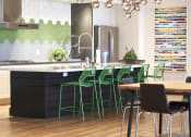 Thumbnail 21 of 84 - Community kitchen with stainless steel appliances at The Promenade Rio Vista, San Diego, CA