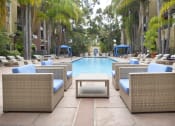 Thumbnail 49 of 84 - Outdoor pool area with lounge at The Promenade Rio Vista, San Diego, CA chairs