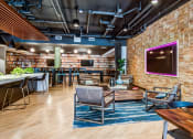 Thumbnail 63 of 84 - Clubroom seating area and TV at The Promenade Rio Vista, California