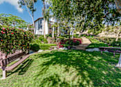 Thumbnail 9 of 39 - Grassy path with bench seating at Ridgecrest, California, 92630