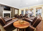 Thumbnail 16 of 39 - Clubroom with lounge seating and tv at Ridgecrest, Lake Forest, 92630