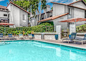 Thumbnail 7 of 39 - Pool with lounge seating at Ridgecrest, Lake Forest, 92630
