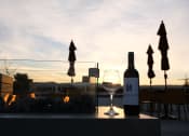 Thumbnail 39 of 83 - bayswater rooftop lounge and fireplace at sunset at Bayswater Apartments, Burlingame