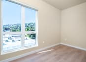 Thumbnail 81 of 117 - A room with a large window overlooking a cityscape. at Skyview Sunset, Los Angeles, CA