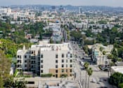 Thumbnail 106 of 117 - A cityscape with a large building in the foreground and a busy street. at Skyview Sunset, Los Angeles, CA, 90046