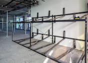 Thumbnail 107 of 117 - A large metal scaffolding structure in a room under construction. at Skyview Sunset, Los Angeles, CA