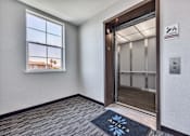 Thumbnail 15 of 40 - an empty room with an open door and a window