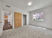 Thumbnail 36 of 40 - an empty living room and kitchen with a large window