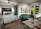 Thumbnail 9 of 25 - A bedroom with a bed, a green couch, and a glass table.at Chelsea Santa Monica, Santa Monica, CA  
