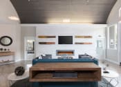 Thumbnail 8 of 36 - Clubroom with fireplace and TV at Montrachet Apartments, California