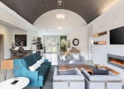 Thumbnail 9 of 36 - Clubroom with fireplace and TV at Montrachet Apartments, California