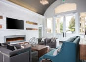 Thumbnail 10 of 36 - Clubroom with fireplace and TV at Montrachet Apartments, California, 94558