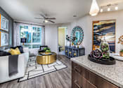 Thumbnail 2 of 30 - Kitchen And Living Area at Rize Irvine, Irvine, CA, 92614
