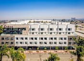 Thumbnail 4 of 43 - Large white building at Urbana Apartments, Chula Vista, CA