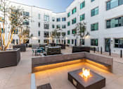 Thumbnail 8 of 43 - Rooftop seating with fire pit at Urbana Apartments, Chula Vista, 91910