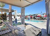 Thumbnail 13 of 87 - A patio with a pool and a palm tree.