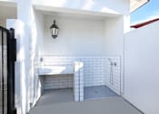 Thumbnail 22 of 87 - A white bathroom with a black fence and a black lantern.