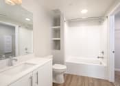 Thumbnail 67 of 87 - A white bathroom with a sink, toilet, and bathtub.