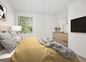Thumbnail 77 of 87 - A bedroom with a bed covered in a yellow blanket and a white pillow.