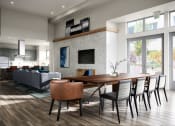 Thumbnail 17 of 50 - Apartments for Rent in Mission Bay, San Francisco CA - Spacious Clubhouse At Strata at Mission Bay with a Catering Kitchen, Dining Table, and Living Room Area with Plenty of Light at Strata at Mission