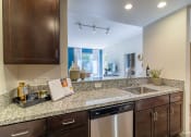 Thumbnail 7 of 50 - redesigned kitchen with granite counter tops and stainless steel appliances and a window at Strata at Mission Bay, San Francisco, CA, 94158