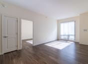 Thumbnail 36 of 50 - an empty living room with wood flooring and a window at Strata at Mission Bay, San Francisco, CA, 94158