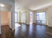 Thumbnail 40 of 50 - an empty living room with wood flooring and a large window at Strata at Mission Bay, San Francisco, 94158