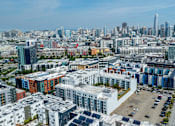 Thumbnail 46 of 50 - A cityscape with a mix of residential and commercial buildings.