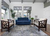 Thumbnail 37 of 39 - Leasing office with blue couch at Sunstone Place, California, 92505