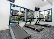Thumbnail 26 of 39 - treadmills in front of a window in a gym at Sunstone Place, Riverside, CA