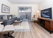 Thumbnail 5 of 39 - an apartment living room with a couch and a tv at Sunstone Place, California, 92505
