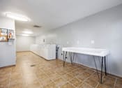 Thumbnail 20 of 142 - A room with a table and chairs in it.