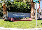Thumbnail 32 of 142 - A sign that says Terrace Hill is in front of some trees.