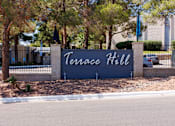 Thumbnail 34 of 142 - A sign that says Terrace Hill stands in front of a building.