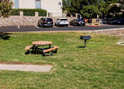 Thumbnail 39 of 142 - A park with a bench and a soccer goal.