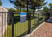 Thumbnail 44 of 142 - A sign on a fence that says Park Rules.