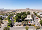 Thumbnail 56 of 142 - A view of a roundabout with a building in the background.