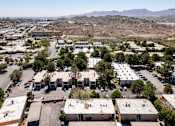 Thumbnail 58 of 142 - A large parking lot with several buildings in the background.