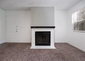 Thumbnail 94 of 142 - A room with a fireplace and a door.