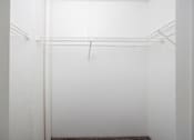 Thumbnail 104 of 142 - A white wall with a wire shelf attached to it.