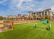 Thumbnail 4 of 39 - Outdoor Dog Park With Several Obstacle Course Items and a Fenced Perimeter at Terracina, Broomfield, CO 80020