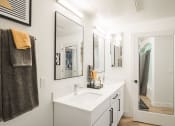 Thumbnail 34 of 39 - a bathroom with a sink and a mirror at Terracina, Colorado 80020