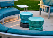 Thumbnail 24 of 27 - A set of outdoor furniture including a sofa, chairs and tables at Nola 624 Apartments, California